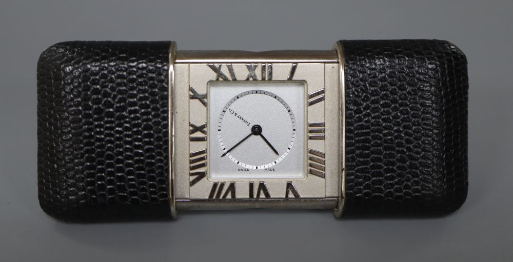 Tiffany & Co. A stainless steel and leather mounted purse alarm watch,